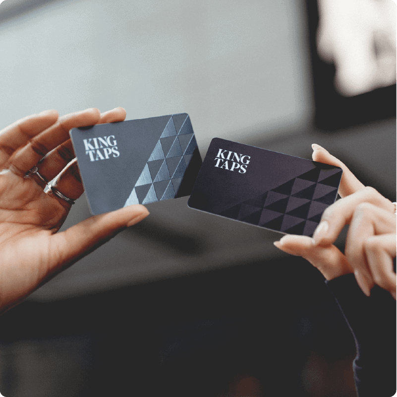 Holding two King Taps gift cards
