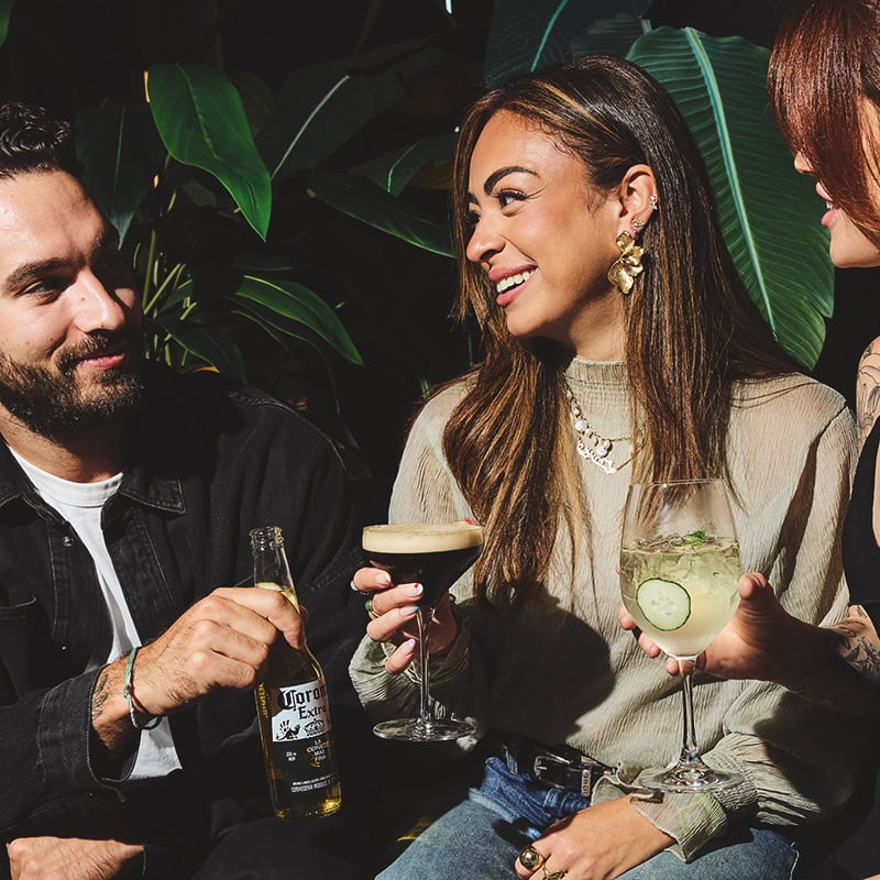 Group of people enjoying cocktail drinks at King Taps for private dining & events