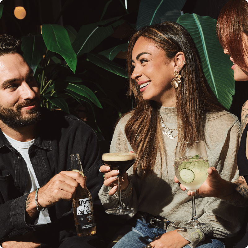 Group of people enjoying cocktail drinks at King Taps for private dining & events